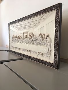 the last supper is depicted in an intricately detailed frame on display at the museum