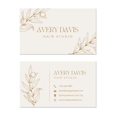 two white business cards with gold foil leaves on them and the words avery davis hair studio