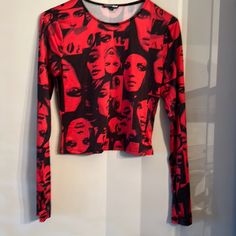 Women’s Red And Black Fashion Top . Never Worn Edgy Red Top For Night Out, Edgy Red Top With Graphic Print, Edgy Red Graphic Print Top, Trendy Printed Red Tops, Trendy Red Printed Top, Fitted Red Top In Edgy Style, Red Printed Party Tops, Edgy Red Tops For Fall, Trendy Red Tops For Night Out