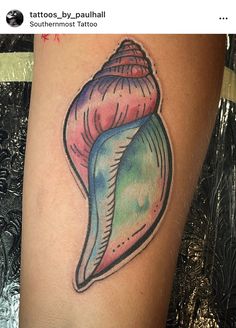 a tattoo with a colorful sea shell on it