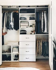 an organized closet with clothes, shoes and other items in it's storage area