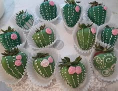 chocolate covered strawberries are arranged in the shape of heart - shaped cactuses with pink flowers on them