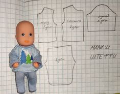 an image of a doll that is next to a paper cutout with clothes on it