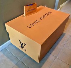 a louis vuitton box sitting on the floor