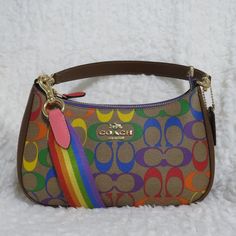 Coach Signature Rainbow Teri Shoulder Bag (Ca176) Khaki Rainbow Signature Coated Canvas. Leather Accents And Detachable Handle. Removable, Adjustable 23.75" Crossbody Strap. Top Zip Closure. Interior Multi-Function Pocket. 9.5" (L) X 6" (H) Luxury Bags Collection, Rainbow Bag, Cute Handbags, Luxury Purses, Fancy Bags, Leather Accents, Luggage Sets, Strap Top, Price Tag