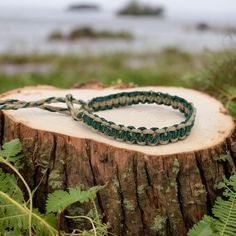 Embrace earthy tones with this handmade sage green hemp bracelet. Perfect for surfers and boho lovers, it’s crafted from natural eco-friendly materials. This adjustable bracelet offers a relaxed beach style, ideal for casual wear or gifting someone special who loves nature-inspired, sustainable fashion.Material: natural hempWidth: about 1/2 inch (10-12cm)Color: Sage green and naturalLength: 6 inch or custom Closure: braided loop and ties closure, make the bracelet more adjustable . If you want y Rustic Green Adjustable Jewelry, Adjustable Rustic Green Bracelets, Adjustable Rustic Green Bracelet, Rustic Green Adjustable Bracelet, Adjustable Green Bracelets For Outdoor, Green Macrame Bohemian Bracelets, Green Bohemian Macrame Bracelets, Casual Handmade Outdoor Jewelry, Green Macrame Friendship Bracelets For Beach