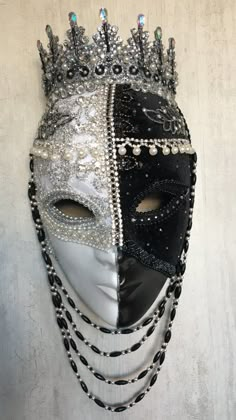 Unique full face mask, handcrafted in dramatic black and white. Embossed silver/white brocade and black velvet fabric embellished with diamantes, pearls, braid, crystals and jet beads. Stunning wall decoration for your home or studio or perfect as a unique statement piece for that masquerade ball or party.  Each Tiaura Arts piece comes with signed and dated certification detailing its unique title and catalogue number.  To see the full range of my work, I invite you to visit my website: www.tiau Luxury Artistic Masks For Mardi Gras, Luxury Masks And Prosthetics For Mardi Gras, Silver Full Face Mask For Masquerade, Silver Full Face Masquerade Mask, Full Face Silver Masquerade Mask, Masquerade Mask Full Face, Venetian Masks Art, Masquerade Ball Mask, Venice Mask