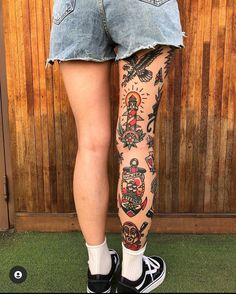 a woman's legs with tattoos on them