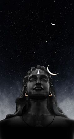 an image of a buddha statue with the moon in the sky