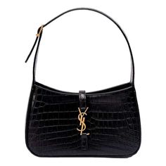 Expertly crafted from crocodile embossed leather, the Saint Laurent YSL Cocco Print Black Hobo Bag exudes timeless French sophistication. The structured shape and polished Gold Tonetone hardware add a touch of elegance, while the spacious interior can easily fit all your daily necessities. Complete with the iconic YSL monogram, this bag is perfect for everyday use.  Measurements: 9"L x 2.5"W x 6.25"H Interior Pockets: One zip pocket Handles: Single flat leather shoulder strap Handle Drop: 8" adjustable Closure/Opening: Open top with middle flap tab Interior Lining: Suede lining Hardware: Gold Tonetone Model Number: 657228 Black Hobo Bag, Ysl Purse, Saint Laurent Tote, Ysl Handbags, Rose Bag, Luxury Purses, Daily Necessities, Monogram Bag, The Saint