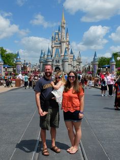 a man and woman standing in front of a castle with the words favorite magic kingdom eats on it