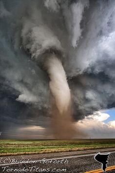 a very large tornado is coming out of the sky