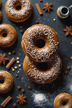 doughnuts with cinnamon sprinkles and star anise on a table