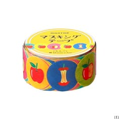 a small tin with an apple design on the top and two different colored circles around it