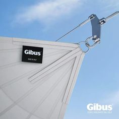 a close up of a white umbrella with a sign on it that says gibus