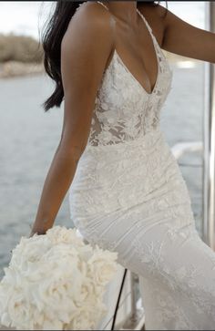 a woman in a wedding dress on a boat