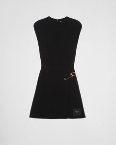 Fit and flare Unlined Round neck Back zipper closure Sleeveless Leather logo label Flared hem Safety pin detail on the faux wrap skirt Vintage Prada Dress, Prada Clothes Women, Prada Dress Couture, Prada Outfits Women, Prada Outfits, Luxury Skirt, Prada Clothes, Prada Dresses, Prada Runway