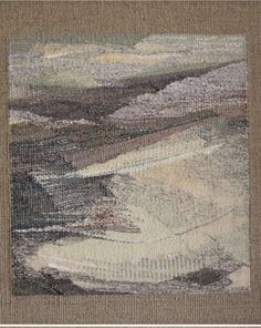 a close up of a piece of art on a carpeted floor with an area rug in the middle