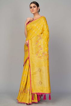 Monjolika fashion presents look simple and sober in festive event and function with this stunning yellow color designer saree. This party wear pure viscose dola silk saree is decorated with fancy woven embroidery work. The saree comes along with matching rani pink color banarasi dupion silk heavy work unstitched blouse piece that can be custom tailored upto 42 inches. Product Features: Saree Color: Yellow Blouse Color: Magenta Saree Fabric: Art Silk Blouse Fabric: Art Silk Saree Work: Woven Blou Semi-stitched Yellow Slub Silk Saree, Semi-stitched Yellow Saree In Slub Silk, Magenta Saree, Luxury Yellow Raw Silk Pre-draped Saree, Pre Stitched Saree, Yellow Saree With Woven Motifs, Woven Embroidery, Dola Silk Saree, Saree Work