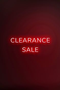 a red neon sign that says clearance sale