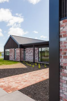 an open door leading to a brick building