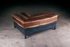 a wooden box sitting on top of a cement floor