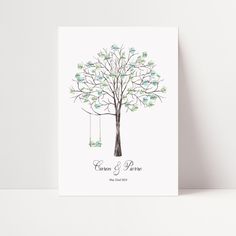 a wedding card with a tree and two birds on it