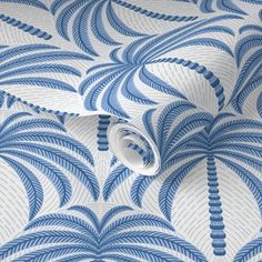 a blue and white wallpaper with an abstract design