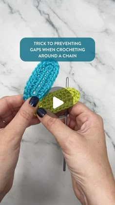 a person is holding two pieces of blue and green yarn with the words trick to preventing gas when crocheting around a chain