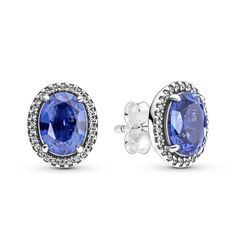 Make your look shine with the Sparkling Statement Halo Earrings. Stunning raised oval princess blue man-made crystals are framed by a halo of sparkling clear cubic zirconia to create the feel of heirloom jewelry. Hand-finished in sterling silver, the earrings feature a prong setting to elevate the main stone from its pavé frame. Elevate your everyday style with these show-stoppers or wear them to make special occasions sparkle even more. Pandora Earrings, Halo Stud Earrings, Bracelet Pandora, Heirlooms Jewelry, Halo Earrings, Halo Earrings Studs, Sterling Silver Studs, Sterling Silver Earrings Studs, 925 Sterling Silver Earrings