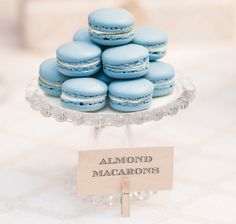 blue macaroons are stacked on top of each other