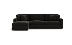 a black couch with pillows on it