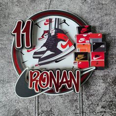 a clock with nike shoes on it and the words'14 ronan'written in red