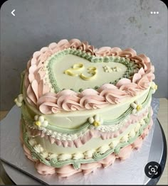 a heart shaped cake sitting on top of a table