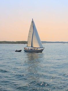 a sailboat is sailing in the open water