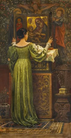 a painting of a woman in a green dress looking at an image on a wall