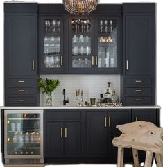 a kitchen with black cabinets and white counter tops, an open wine cooler in the center