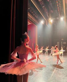 a group of ballerinas are performing on stage