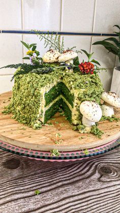 there is a cake that has been decorated with moss and eggs on top of it