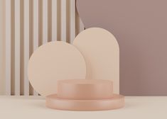 two round plates sitting on top of a table next to a wall with vertical stripes