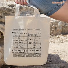 a person is holding a bag that has information on the front and side of it