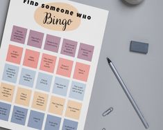 a binder with the words find someone who bing on it next to a cup of coffee