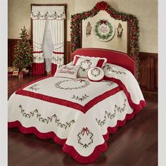 a red and white bed in a room with christmas decorations