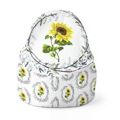 a white hat with a yellow sunflower on it