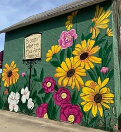 there is a mural painted on the side of a building