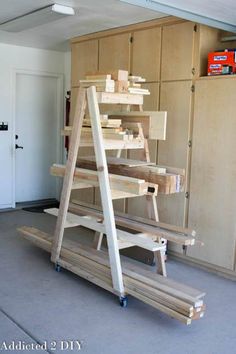 a wooden shelf sitting in the middle of a room with shelves on each side and two ladders attached to it