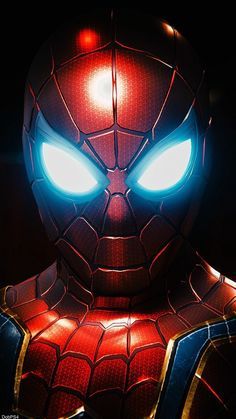 the amazing spider - man is shown with glowing eyes