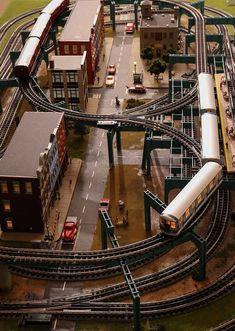 a model train set with multiple tracks and buildings