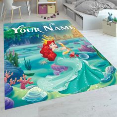 the little mermaid rug is on the floor