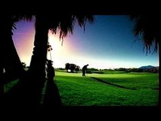 two people playing golf on a beautiful day